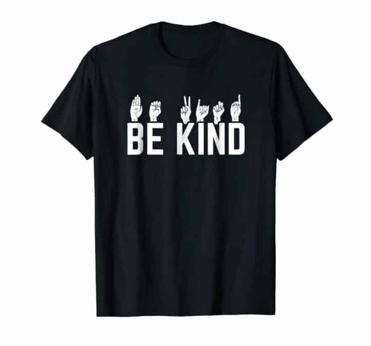 Black t-shirt with the text "Be kind" and on top of the text each letter is signed in American sign language.