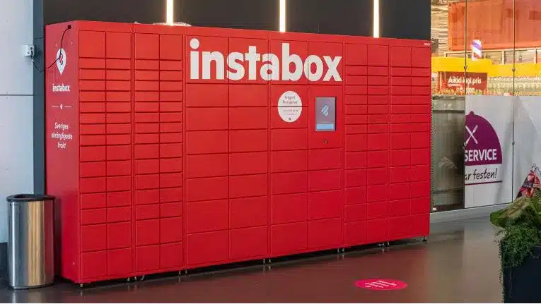 Large furniture like device with different sized doors where packages are delivered. I touch screen in the middle, quite high.
